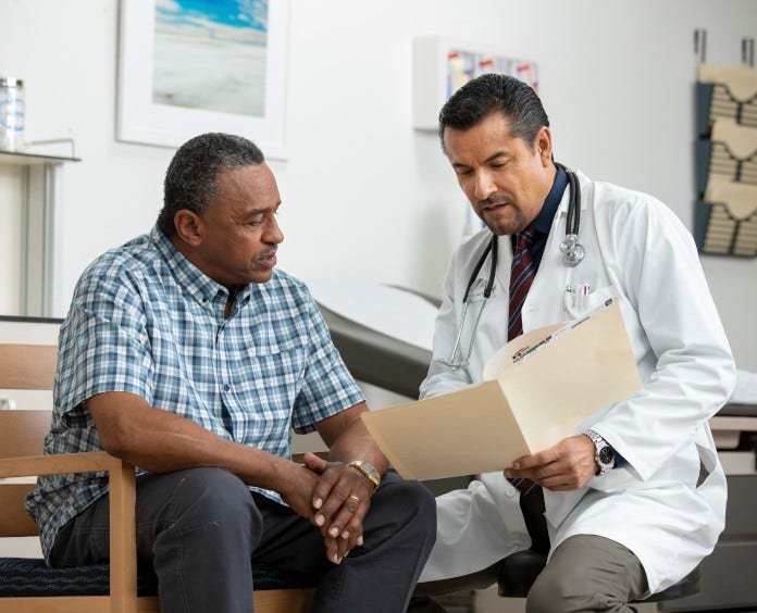 Doctor Discussing Chart with Patient